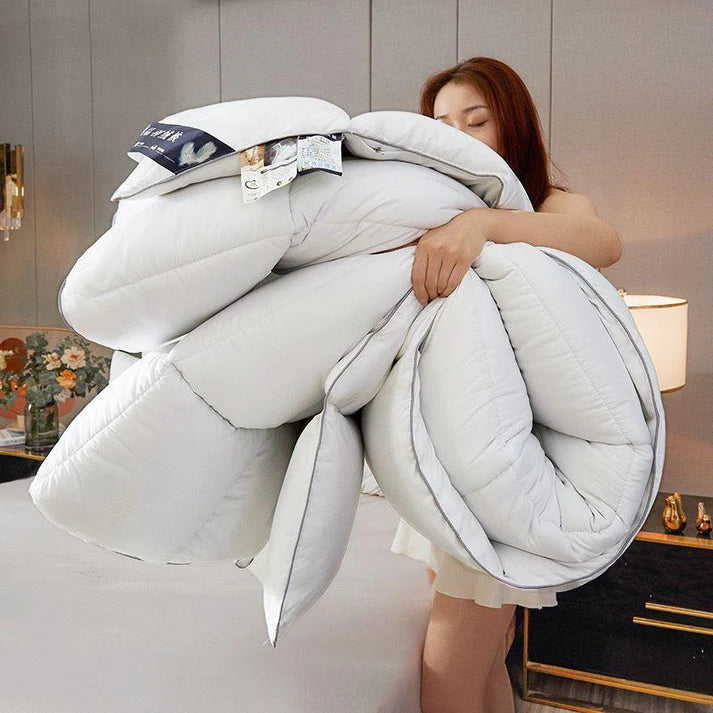 Couette avec deux oreillers déjà remplis